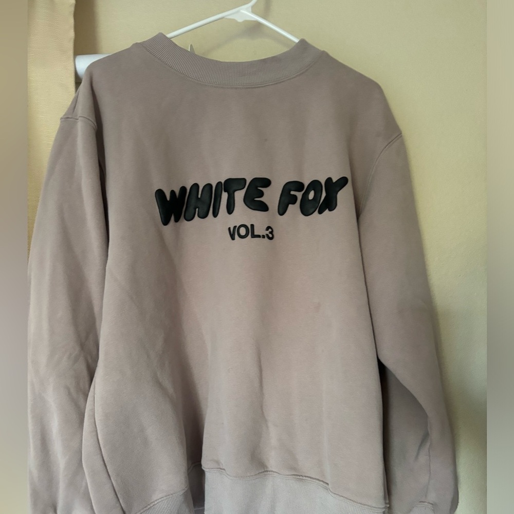 White Fox sweatshirt.